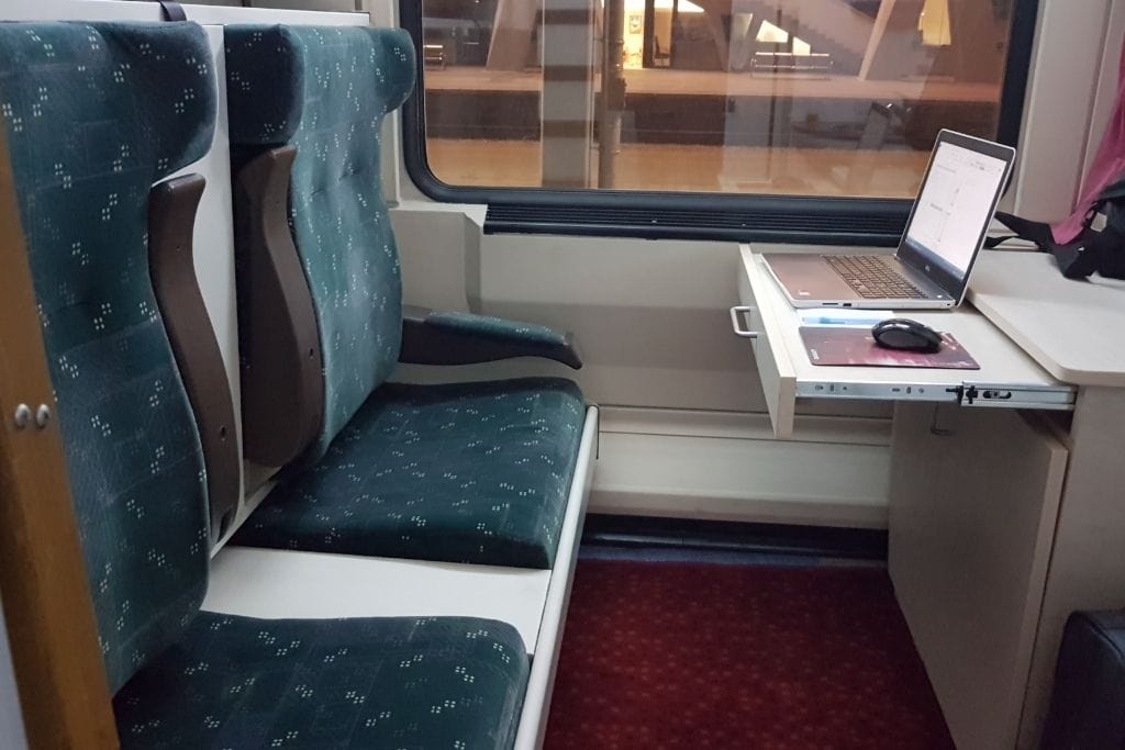 Comfortable seating and workspace in a sleeper cabin on the Istanbul to Sofia night train — a convenient and scenic travel option for international visitors.