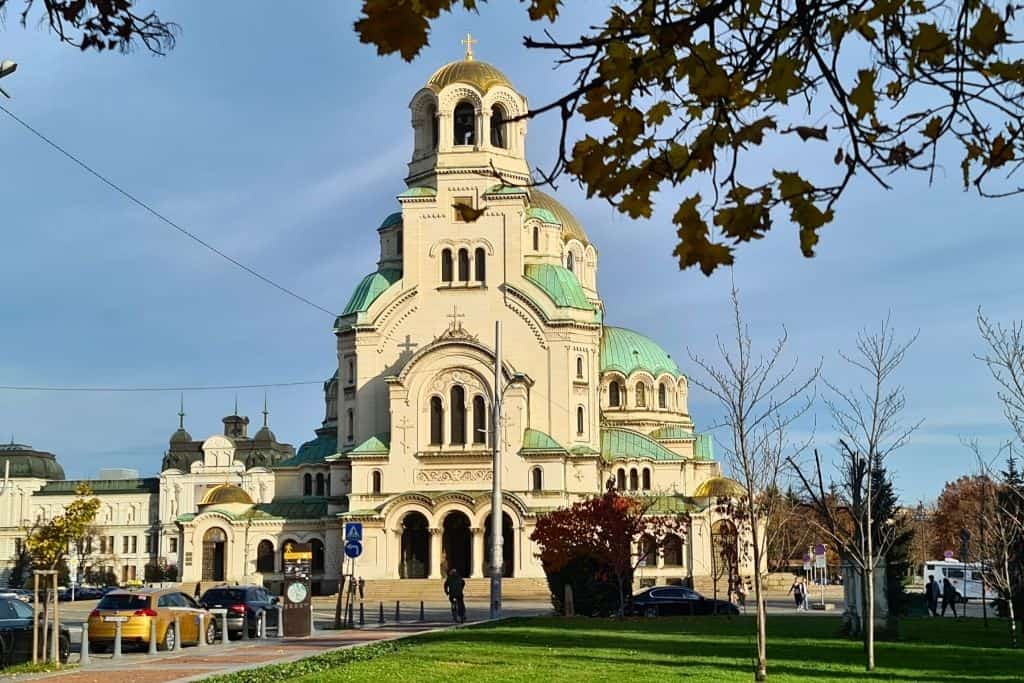 Sofia’s most iconic landmark, the Alexander Nevsky Cathedral, photographed with autumn leaves — a must-see attraction for visitors exploring Bulgarian culture and Orthodox architecture.